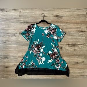 Size is XS. Turquoise Floral Design Blouse with a flowy feel.